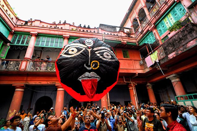 People release a paper lantern during the celebration of the Diwali festival. The Fanush, a paper-made hot air balloon, is an integral part of North Calcutta Heritage Culture, and it is an old tradition to fly Fanush on the day of Kalipujo before Diwali in Kolkata on October 31, 2024. (Photo by Avishek Das/SOPA Images/Rex Features/Shutterstock)