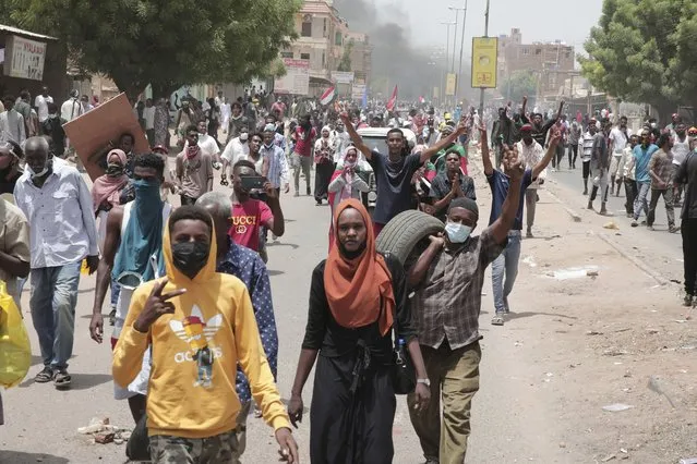Sudanese anti-military protesters march in demonstrations in the capital of Sudan, Khartoum, on Thursday, June 30, 2022. A Sudanese medical group says multiple people were killed on Thursday in the anti-coup rallies during which security forces fired on protesters denouncing the country’s military rulers and demanding an immediate transfer of power to civilians. (Photo by Marwan Ali/AP Photo)
