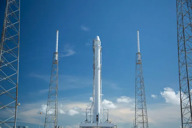 In this Saturday, July 16, 2016, photo provided by SpaceX, the SpaceX Falcon rocket stands at its launch pad at Cape Canaveral, Fla. The unmanned rocket is scheduled to blast off at 12:45 a.m. EDT Monday with 5,000 pounds of supplies for the International Space Station. (Photo by SpaceX via AP Photo)