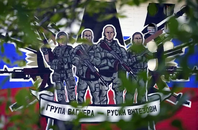 A mural depicting mercenaries of Russia's Wagner Group that reads: “Wagner Group – Russian knights” on a wall in Belgrade, Serbia, Tuesday, September 20, 2022 (Photo by Darko Vojinovic/AP Photo)