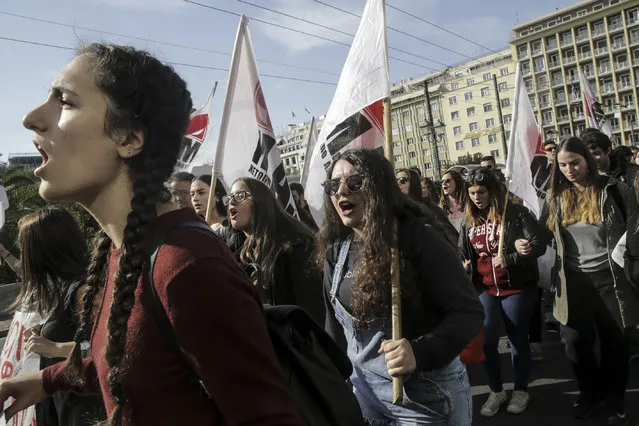 Students march during a protest demanding education reforms in front of the Parliament Building at Syntagma Square in Athens, Greece on November 7, 2017. College students marched to demand better education opportunities. (Photo by Ayhan Mehmet/Anadolu Agency/Getty Images)