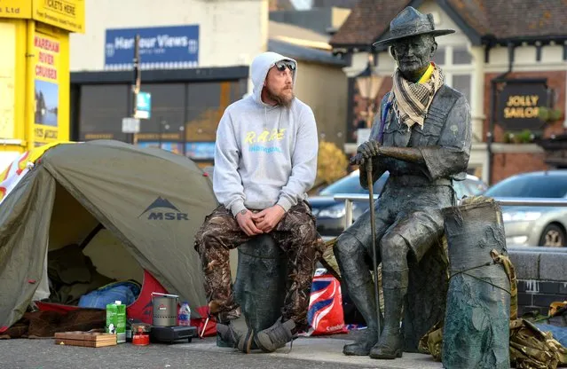 Former Scout Dan Davies at his tent, set up to protect the Lord Baden-Powell statue on June 12, 2020 in Poole, United Kingdom. The statue of Robert Baden-Powell on Poole Quay is to be placed into safe storage after campaigners have accused him of racism, homophobia and support for Adolf Hitler. (Photo by Finnbarr Webster/Getty Images)