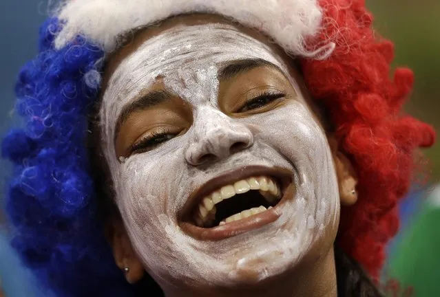 A French fan cheers before the women's preliminary handball match between France and Russia at the 2016 Summer Olympics in Rio de Janeiro, Brazil, Monday, Aug. 8, 2016. (AP Photo/Ben Curtis) ORG XMIT: OHNB124