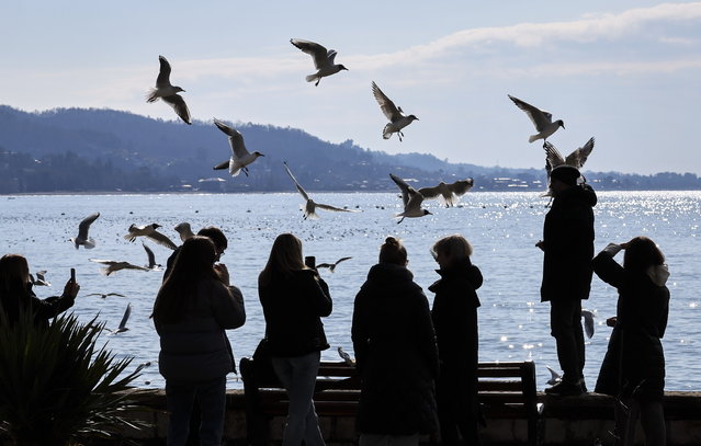 Local people enjoy the warm weather near the Black Sea shore in Sukhumi, the capital of the self-proclaimed republic of Abkhazia, 02 March 2025 (issued 11 March 2025). Abkhazia, a breakaway territory of Georgia since 2008 and recognized by a limited number of countries, including Russia, relies on tourism as a key economic driver. Its Black Sea coastline, with its mild climate and Soviet-era sanatoriums, continues to attract primarily Russian tourists, despite aging infrastructure and remnants of past conflict. (Photo by Yuri Kochetkov/EPA)