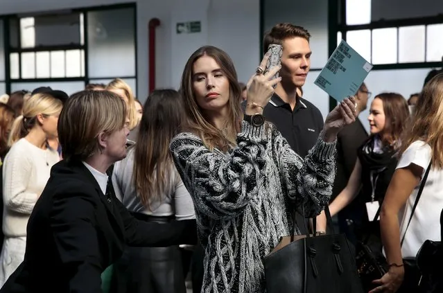A security guard asks a guest to continue to her seat and not hold up the queue by taking selfies before the presentation of the Holly Fulton Spring/Summer 2016 collection during London Fashion Week in London, Britain September 19, 2015. (Photo by Suzanne Plunkett/Reuters)