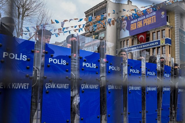 Police officers stand in a street around the provincial police headquarters where Istanbul Mayor Ekrem Imamoglu is being held after his arrest, in Istanbul on March 19, 2025. Turkish police raided the home of Istanbul Mayor Ekrem Imamoglu on March 19, 2025, detaining him over a corruption probe in a move denounced by the main opposition CHP party as a “coup”. (Photo by Kemal Aslan/AFP Photo)