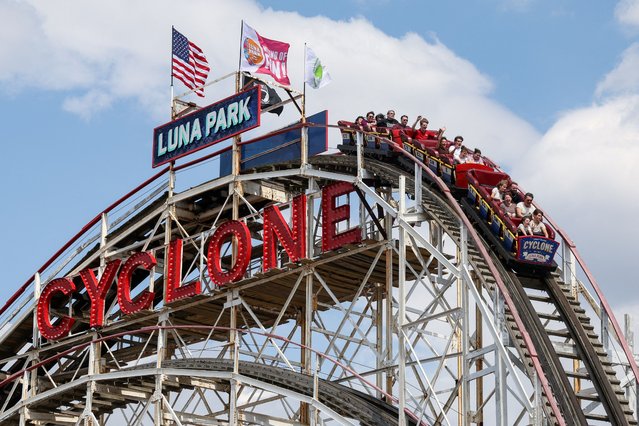 People ride Cyclone at Luna Park in Coney Island on opening day of the season in Brooklyn, New York on March 29, 2025. (Photo by Kylie Cooper/Reuters)