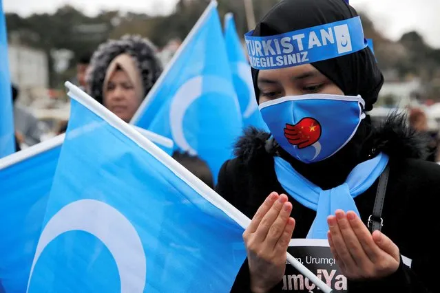 Ethnic Uyghur demonstrators take part in a protest against China, near the Chinese consulate in Istanbul, Turkey on December 4, 2022. (Photo by Dilara Senkaya/Reuters)