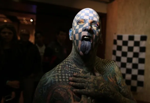 Matt Gone, also known as “The Checkered Man”, poses during a tattoo convention in Bogota November 14, 2014. Gone claims to be one of the most tattooed people in the world with 98 percent of his body inked. (Photo by Jose Miguel Gomez/Reuters)