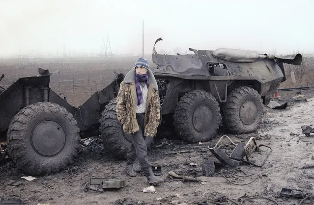 In this Thursday, January 31, 1995 file photo, a Chechen looks towards a Russian checkpoint as he stands in front of the wreckage of a Russian armored personnel carrier that was destroyed in a clash with Chechen rebels and Russian troops at the west entrance of Samashki, a Chechen village 25 miles west of Grozny. Karsten Thielker, a Pulitzer Prize-winning German photographer with The Associated Press who covered human suffering in conflict zones around the globe, has died. He was 54. Thielker died Oct. 3 in Berlin of esophageal cancer, his wife Janna Ressel said Thursday, Oct. 8, 2020. (Photo by Karsten Thielker/AP Photo/File)