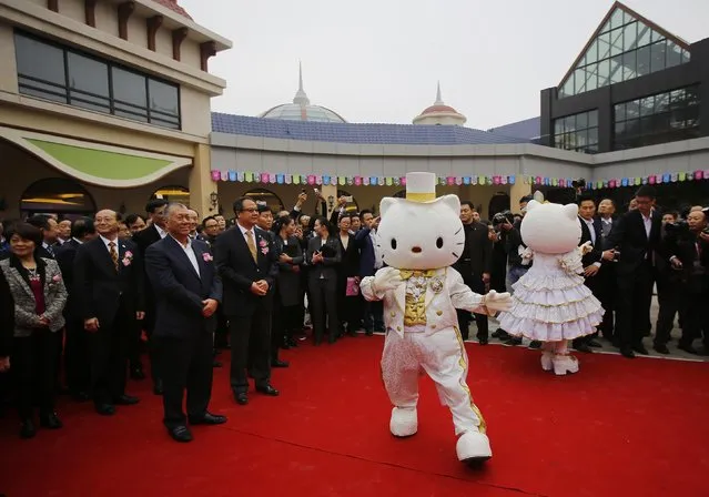 Guests attend an inauguration ceremony of a Hello Kitty amusement park in Anji, Zhejiang province November 28, 2014. (Photo by Carlos Barria/Reuters)
