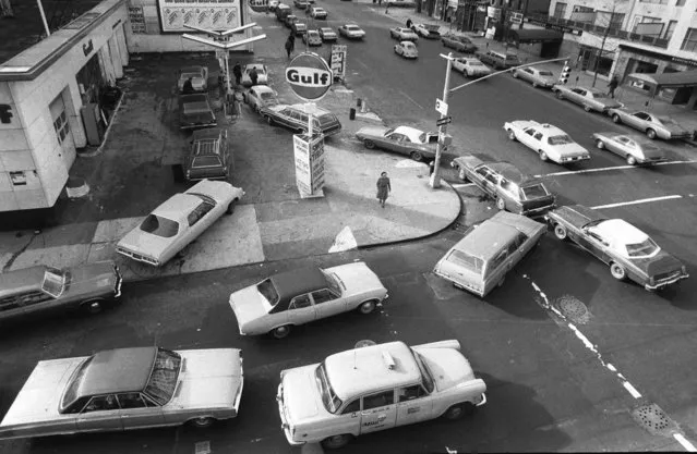 Cars line up in two directions on Sunday December 23, 1973 at a gas station in New York City. The gas station remianed opened despite President Nixon's plea for stations to close on Sundays. (Photo by Marty Lederhandler/AP Photo)