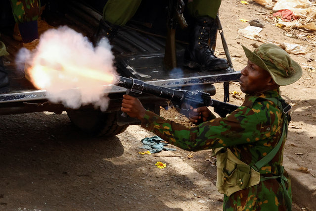 A riot police officer fires tear gas during clashes with demonstrators at the “Saba Saba People's March” anti-government protest in Nairobi, Kenya on July 7, 2025. (Photo by Thomas Mukoya/Reuters)
