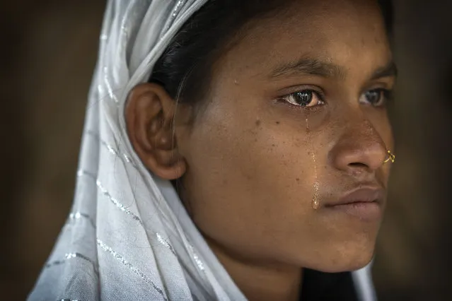Nureja Khatun, 19, cries as she waits in her shanty home for her husband Akbor Ali to return, in Morigaon district of Indian northeastern state of Assam, Saturday, February 11, 2023. Khatun's husband is one among more than 3,000 men, including Hindu and Muslim priests, who were arrested nearly two weeks ago in the northeastern state of Assam under a wide crackdown on illegal child marriages involving girls under the age of 18. (Photo by Anupam Nath/AP Photo)