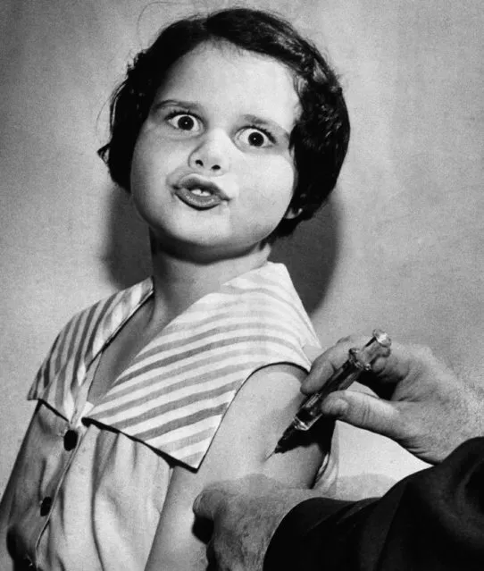 Eight-year-old Ann Hill registers a startled expression upon receiving one of the first Salk polio vaccine shots in Tallahassee, FL., April 18, 1955. Similar shots will go to 2,800 children in Tallahassee, which had a polio epidemic last year. (Photo by AP Photo)