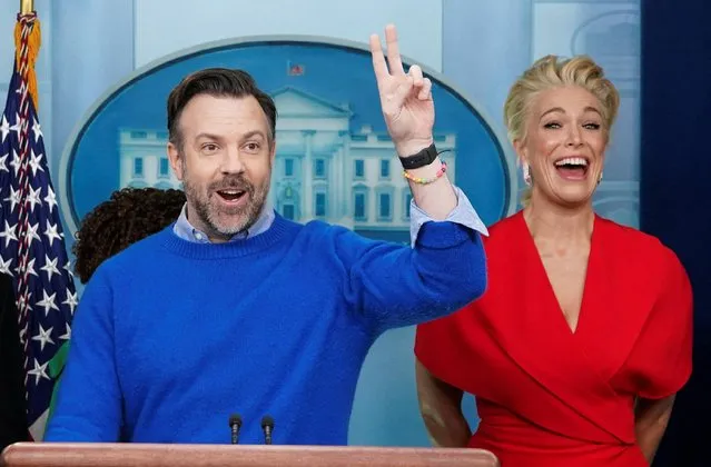 Hannah Waddingham reacts as Jason Sudeikis takes questions while the cast of Ted Lasso joined Press Secretary Karine Jean-Pierre at the daily press briefing to discuss the importance of addressing mental health to promote overall well-being, in the Brady Press Briefing Room at the White House in Washington, U.S., March 20, 2023. (Photo by Kevin Lamarque/Reuters)