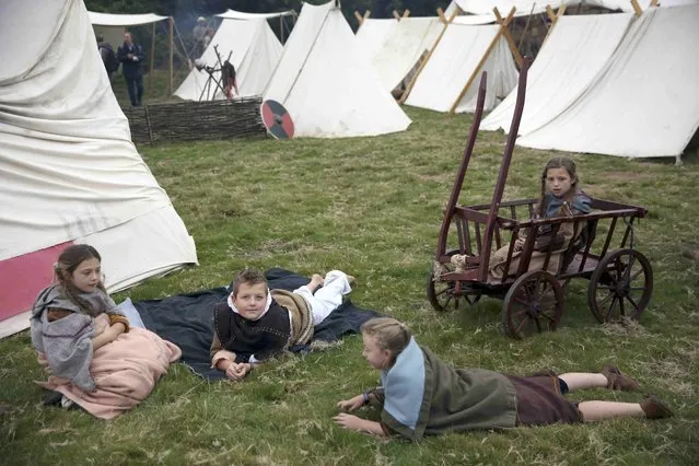 Re-enactors dress in historical costume as part of the Battle of Hastings anniversary commemoration events in Battle, Britain October 15, 2016. (Photo by Neil Hall/Reuters)