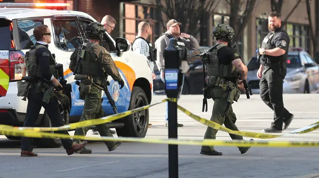Police deploy at the scene of a mass shooting near Slugger Field baseball stadium in downtown Louisville, Kentucky, U.S. April, 10, 2023. (Photo by Michael Clevenger/USA Today Network via Reuters)
