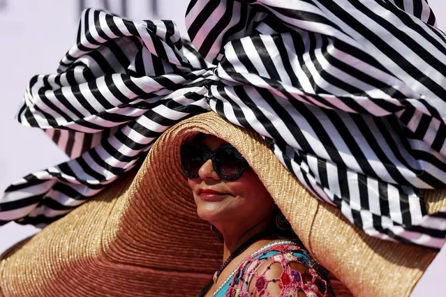 A racegoer looks on during the Dubai World Cup at Meydan Racecourse on March 25, 2023 in Dubai, United Arab Emirates. (Photo by Christopher Pike/Getty Images)