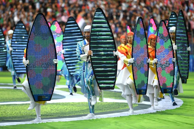 Dancers perform while Williams and Garifullina perform a medley of some of his hits during the opening ceremony before the Russia 2018 World Cup Group A football match between Russia and Saudi Arabia at the Luzhniki Stadium in Moscow on June 14, 2018. (Photo by Matthias Hangst/Getty Images)