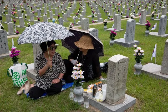 South Korean relatives of a victim of the war pay their respects during a visit to the Seoul National Cemetery in Seoul, South Korea, 05 June 2023, South Korea will observe the 68th Memorial Day on 06 June, which was first observed in 1956, commemorating the men and women who died in military service during the Korean War (1950-53). (Photo by Jeon Heon-Kyun/EPA/EFE)