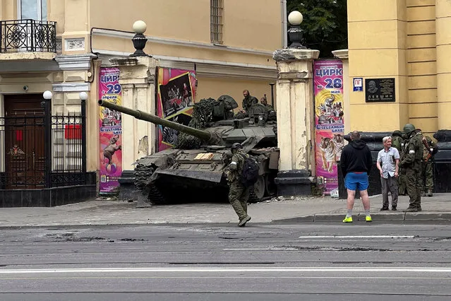 Fighters of Wagner private mercenary group are seen atop of a tank in a street near the headquarters of the Southern Military District in the city of Rostov-on-Don, Russia on June 24, 2023. (Photo by Reuters/Stringer)