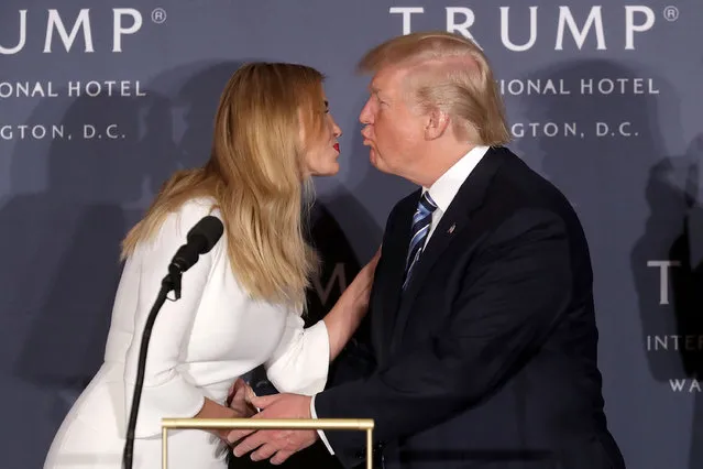 Republican presidential nominee Donald Trump and his daughter Ivanka Trump kiss after speaking during the grand opening of the new Trump International Hotel October 26, 2016 in Washington, DC. The hotel, built inside the historic Old Post Office, has 263 luxry rooms, including the 6,300-square-foot “Trump Townhouse” at $100,000 a night, with a five-night minimum. The Trump Organization was granted a 60-year lease to the historic building by the federal government before the billionaire New York real estate mogul announced his intent to run for president. (Photo by Chip Somodevilla/Getty Images)