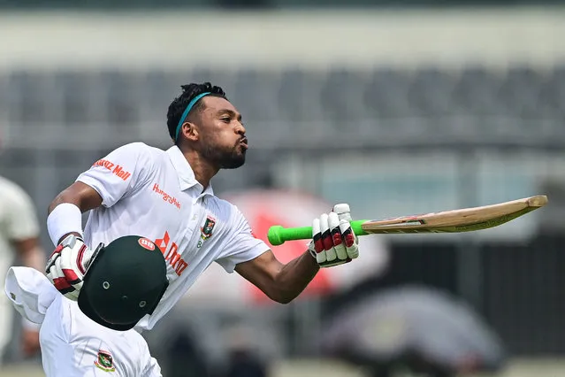 Bangladesh's Najmul Hossain Shanto celebrates after scoring a century (100 runs) during the first day of the Test cricket match between Bangladesh and Afghanistan at the Sher-e-Bangla National Cricket Stadium in Dhaka on June 14, 2023. (Photo by Munir Uz Zaman/AFP Photo)