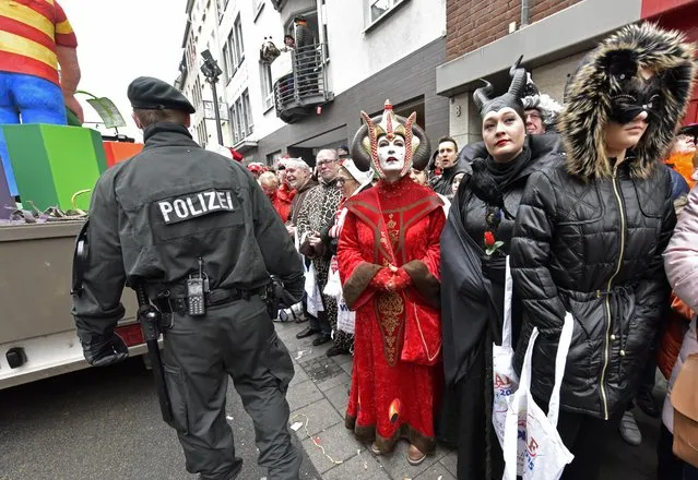 Police secure the traditional carnival parade in Cologne, western Germany, Monday, February 16, 2015. (Photo by Martin Meissner/AP Photo)