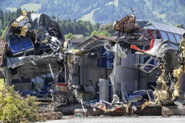 Wagons of the crashed regional train still stands close to the accident site in Garmisch-Partenkirchen, Germany, Tuesday, June 14, 2022. After the train accident with deaths and injuries people on June 3, 2022, the recovery of the last parts of the train is to be carried with a special rail crane. (Photo by Peter Kneffel/dpa via AP Photo)
