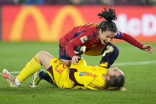 Spain's Ivana Andres celebrates with goalkeeper Cata Coll, on the ground, at the end of the Women's World Cup soccer final between Spain and England at Stadium Australia in Sydney, Australia, Sunday, August 20, 2023. Spain won 1-0. (Photo by Abbie Parr/AP Photo)