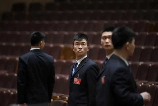 Security personnel stand guard after the opening session of the Chinese People's Political Consultative Conference (CPPCC) at the Great Hall of the People in Beijing, March 3, 2015. REUTERS/Jason Lee