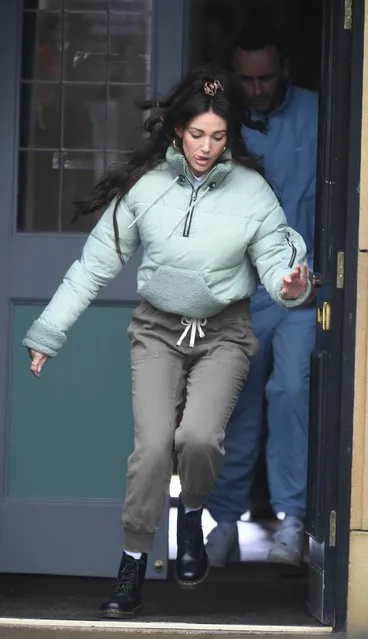 English actress Michelle Keegan, 33, wore grey trousers and a green parka was seen legging it out of a pub in Manchester, United Kingdom on March 10, 2021. (Photo by Zenpix)