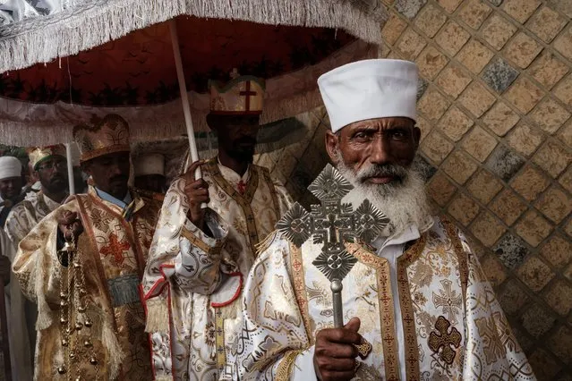 Ethiopian Orthodox priests walk around the church during the Saint Michael's anniversary celebration at St. Michael church in Mekele, the capital of Tigray region, Ethiopia, on June 19, 2021. (Photo by Yasuyoshi Chiba/AFP Photo)