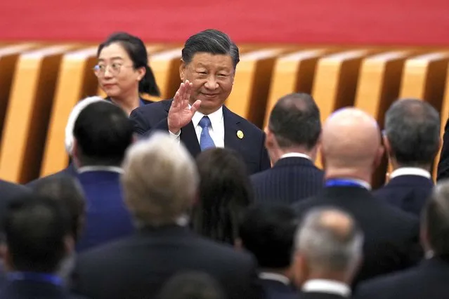 Chinese President Xi Jinping waves as he and foreign leaders arrive at the opening ceremony for the Belt and Road Forum at the Great Hall of the People in Beijing, Wednesday, October 18, 2023. (Photo by Ng Han Guan/AP Photo)