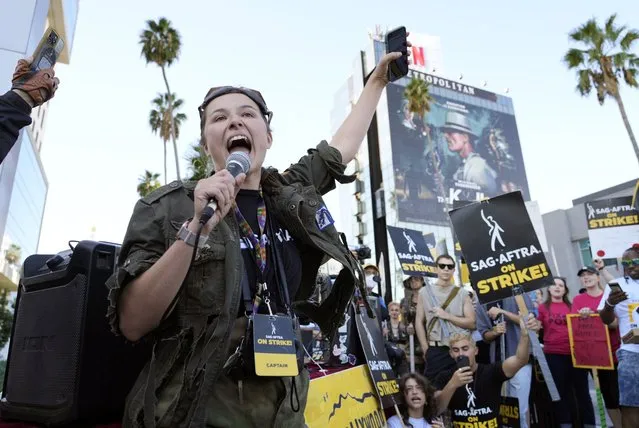 SAG-AFTRA captain Mary M. Flynn rallies fellow striking actors on a picket line outside Netflix studios, Wednesday, November 8, 2023, in Los Angeles. (Photo by Chris Pizzello/AP Photo)