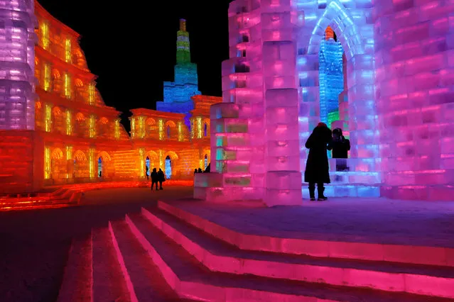 Ice sculptures illuminated by colored lights are seen at annual ice festival, in the northern city of Harbin, Heilongjiang province, China January 4, 2019. (Photo by Tyrone Siu/Reuters)