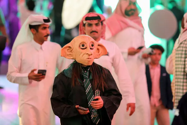 A Saudi youth dressed in a costume celebrates Halloween during “Scary Weekend” event at Boulevard, during Riyadh Season in Riyadh, Saudi Arabia on October 28, 2022. (Photo by Ahmed Yosri/Reuters)