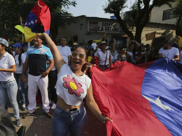 A woman shouts slogans against Venezuela's President Nicolas Maduro during a protest against his government in Urena, Venezuela, Tuesday, February 12, 2019. Nearly three weeks after the Trump administration backed an all-out effort to force out President Nicolas Maduro, the embattled socialist leader is holding strong and defying predictions of an imminent demise. (Photo by Fernando Llano/AP Photo)