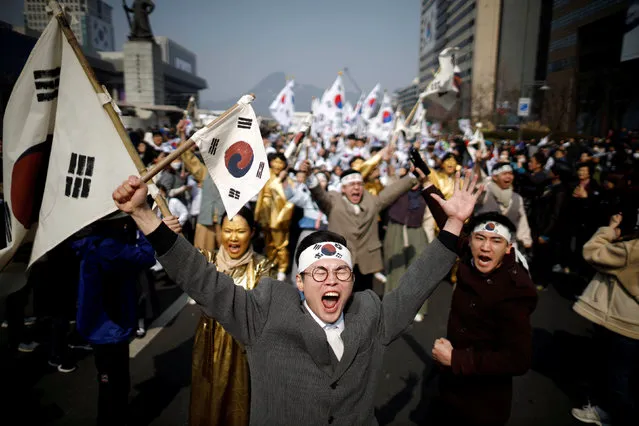 Performers take part in a re-enactment of the historic March First Independence Movement against Japanese colonial rule, in central Seoul, South Korea, March 1, 2019. (Photo by Kim Hong-Ji/Reuters)