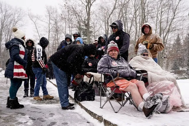 People wait in line before the start of a campaign rally with former U.S. President and Republican presidential candidate Donald Trump ahead of the New Hampshire primary election, in Atkinson, New Hampshire, U.S. January 16, 2024. (Photo by Elizabeth Frantz/Reuters)