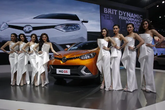 Models pose beside a MG GS during a media presentation at the 37th Bangkok International Motor Show in Bangkok, Thailand, March 22, 2016. (Photo by Chaiwat Subprasom/Reuters)