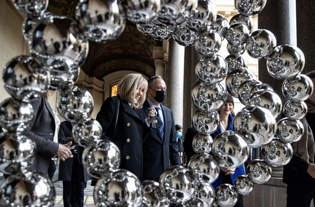 French First Lady Brigitte Macron and U.S. Second Gentleman Doug Emhoff visit an exhibition by French artist Jean-Michel Othoniel at the Petit Palais, in Paris, France on November 12 2021. (Photo by Ian Langsdon/Pool via Reuters)