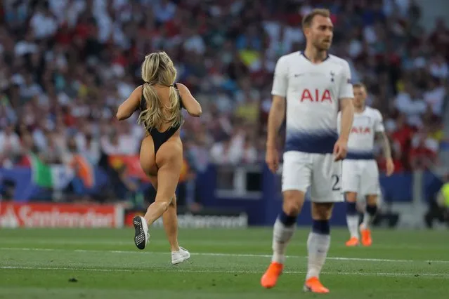 A pitch invader runs during the UEFA Champions League final football match between Liverpool and Tottenham Hotspur at the Wanda Metropolitan Stadium in Madrid on June 1, 2019. (Photo by Javier Soriano/AFP Photo)