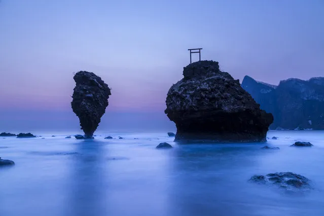 “Strange rock”. There was a very strange rock that is standing in this form to sea before dawn. Photo location: Yoichi Hokkaido, Japan. (Photo and caption by Hiroshi Tanita/National Geographic Photo Contest)