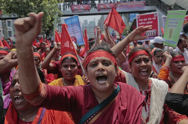 Bangladeshi garment workers shout slogans as they participate in a May Day rally in Dhaka, Bangladesh, Sunday, May 1, 2016. (Photo by A.M. Ahad/AP Photo)