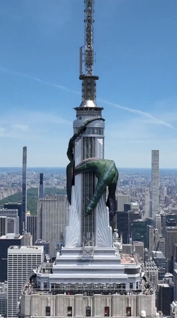 Check out this monster inflatable dragon which has landed on NYC's Empire State Building in a wacky stunt to promote “House of the Dragon” season 2 on June 17, 2024. The hotly-anticipated new season of the Game of Thrones prequel dropped Sunday night on Max. The gigantic green character is wrapped around the top of the city's iconic structure. (Photo by Empire State Realty Trust /TMX/The Mega Agency)