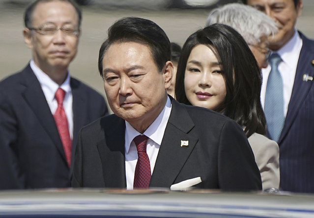 South Korean President Yoon Suk Yeol and his wife Kim Keon Hee arrive at Haneda International Airport in Tokyo, Thursday, March 16, 2023. Yoon and Japanese Prime Minister Fumio Kishida will seek to overcome disputes over history and quickly rebuild security and economic ties when they meet Thursday for the first summit in Japan between the two nations in more than a decade. (Photo by Yuya Shino/Kyodo News via AP Photo)