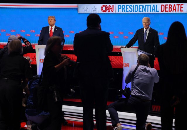 President Joe Biden and former President Donald Trump attend a presidential debate in Atlanta, Georgia, June 27, 2024. (Photo by Brian Snyder/Reuters)