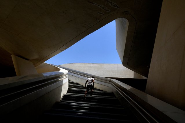 A man walks up the steps at Eleftheria, Liberty, square in central of capital Nicosia, Cyprus, Friday, May 17, 2024. (Photo by Petros Karadjias/AP Photo)